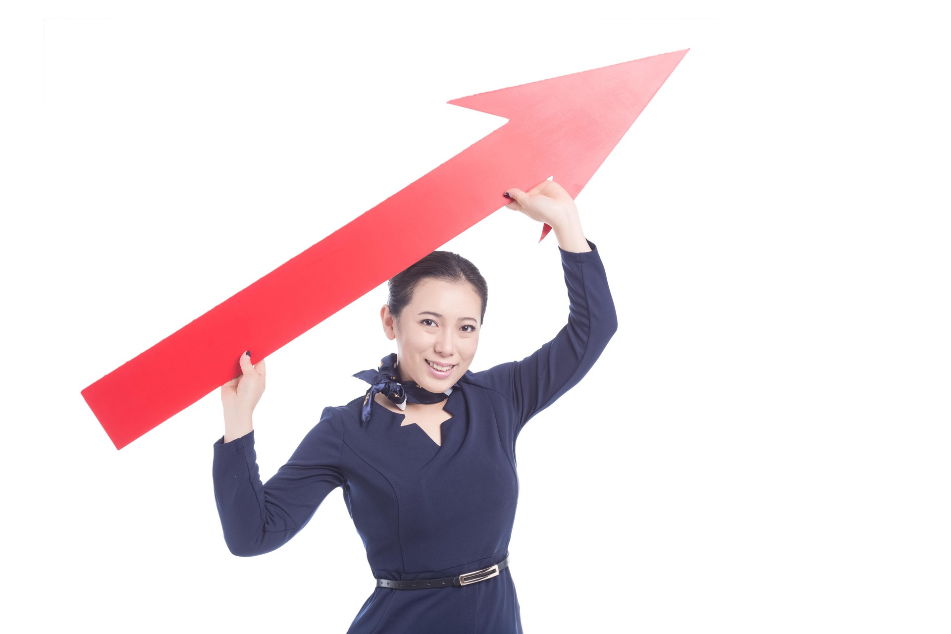 Businesswoman holding a red arrow pointing up